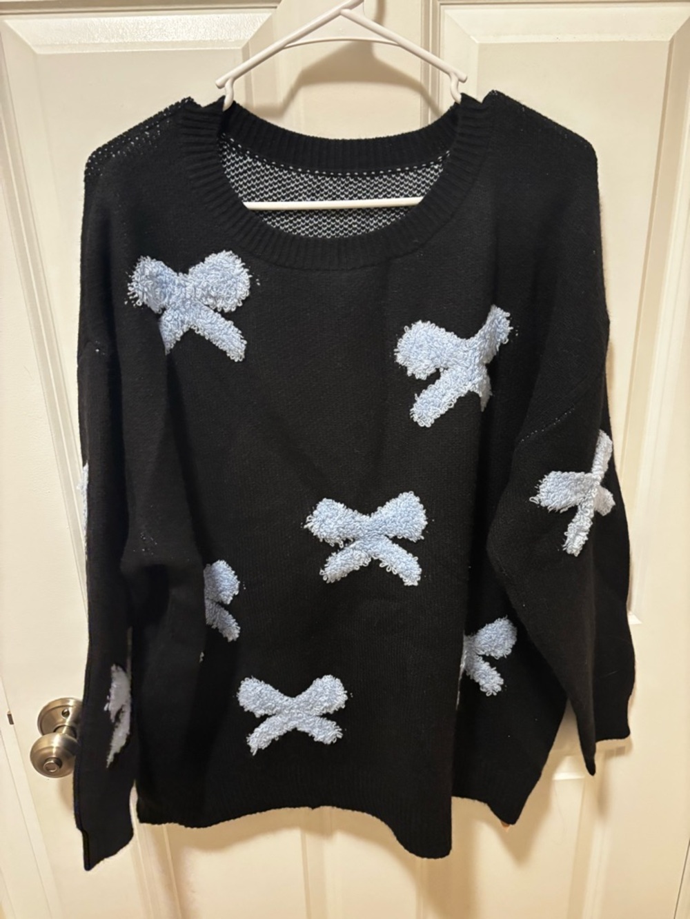 BloomChic Black Crewneck Sweater with Light Blue Bow Accents